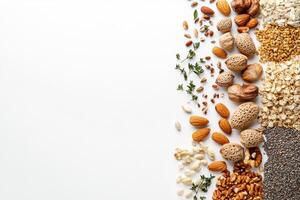 Natural seeds, nuts, and herbs are beautifully arranged on a clean white surface, creating a perfect blank space for custom text or branding. photo