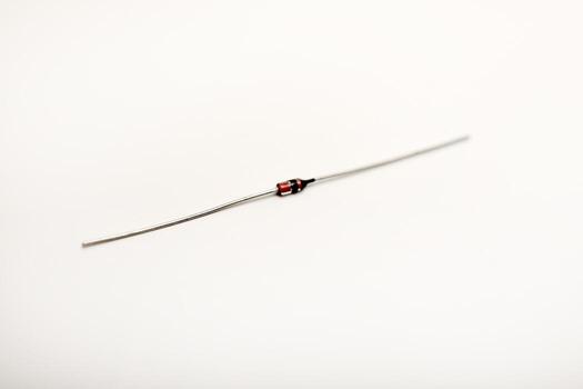 A radio element on a white background. A zener diode. photo