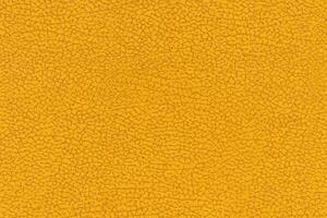 Yellow color abstract textile pattern background. Yellow colour fabric material, colored background photo