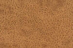 Brown color woven hand abstract textile pattern for background. Image of tawny color fabric material photo