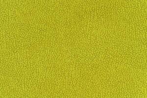 Yellow color abstract textile pattern background. Citrus colour fabric material, colored background photo
