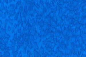 Blue color velour or velvet with short pile fluffy and soft texture, lapis colour background photo
