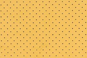 Yellow color abstract artificial leather with small dots and holes pattern for background photo