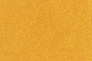 Yellow color abstract textile pattern background. Yellow colour fabric material, colored background photo