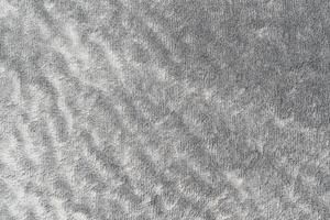 Gray color velvet or velour with short pile fluffy and soft texture background for design photo