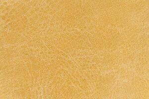 Pale yellow color abstract textile pattern for background. Close-up mustard colour fabric material photo