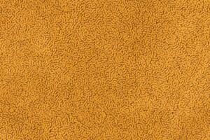 Yellow color fabric material with short haired fluffy and soft texture background photo