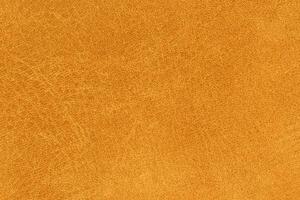 Vibrant yellow color abstract textile pattern for background. Bright gold colored fabric material photo