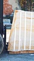 Man driving forklift. Driver loading marble block with equipment Vertical video