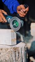 Processing of white marble. Stone processing industry with circular saw. Vertical video