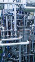 Industrial dairy production. View on the steel pipelines on the milk factory. Vertical video