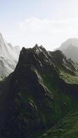 Rocks covered with grass under a cloudy sky video