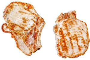 Grilled pork cutlets in a pan. Organic meat steak. Isolated on white background. Top view. photo