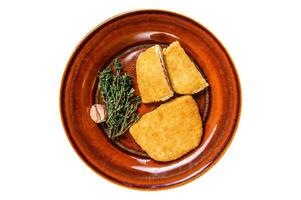 Chicken cordon bleu meat roll cutlet with ham and cheese. Isolated, white background. Top view. photo