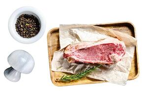 Beef cut with bone. Isolated on white background. Top view. photo