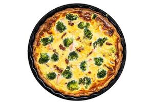 Quiche tart with smoked salmon, broccoli and spinach. Isolated on white background. photo