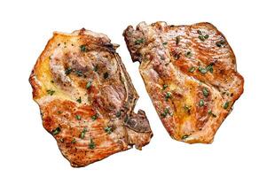 Roasted pork steaks in frying pan from neck meat. Isolated on white background, Top view. photo