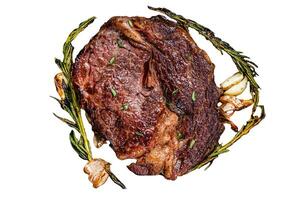 Roasted rib eye steak, ribeye beef meat Isolated on white background, top view. photo