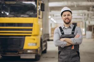 Engineer smiling with crossed arms in modular building factory photo