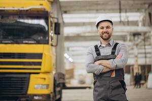 Engineer smiling with crossed arms in modular building factory photo