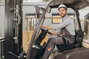 Construction worker driving forklift in modular building industry photo