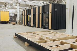 Modular building under construction in a large factory photo