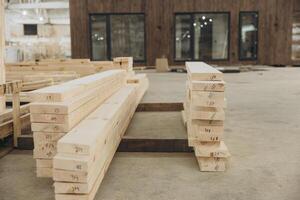 Stacks of lumber forming components of modular building photo