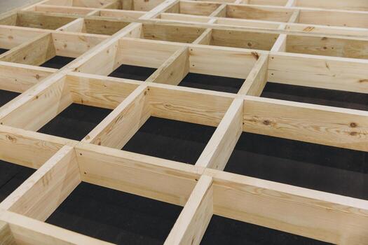 Wooden framework forming grid pattern for modular building construction photo