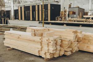 Wooden planks stacked in modular building construction factory photo