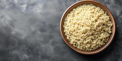 Quinoa neatly arranged in a shallow dish with minimal garnish on the surface, culinary photography photo