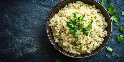 Quinoa portion served in a deep ceramic bowl with visible ingredients and simple garnish, gastronomy photography photo