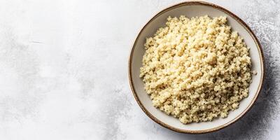Quinoa neatly arranged in a shallow dish with minimal garnish on the surface, food setting photo