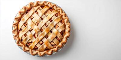 Pie with a full top crust, filled with apple slices, placed on a white surface, food photography photo