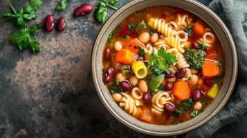 Serving of minestrone soup with visible vegetables, pasta, and beans, food photography photo