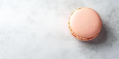 Single macaron on a flat surface, showing its smooth surface, culinary photography photo