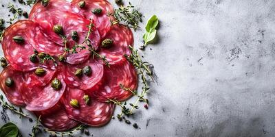 Bresaola slices arranged in a circular pattern with capers scattered on top, culinary photography photo