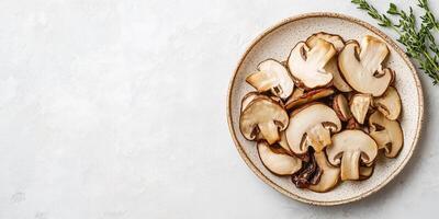 Sliced porcini mushrooms displayed on a plate with a sprig of herbs, photorealistic food photo