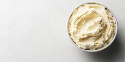 Close-up of spread in a round bowl with a smooth, uniform surface, food setting photo
