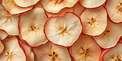 Close-up of dried apple slices in a random pattern, food setting photo