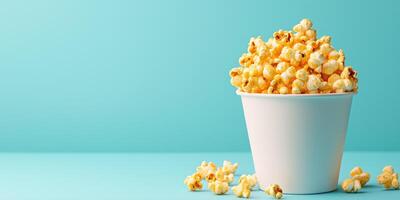 Container filled with kettle corn, with coated kernels spilling over, meal photography photo