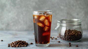 Tall glass of cold brew coffee with ice on a wooden tray with a metal straw beside it, food photography photo