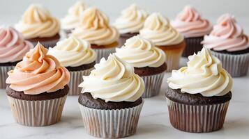 Group of cupcakes with swirled frosting and simple decoration, meal photography photo