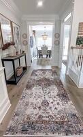 A large rug in a hallway with a wooden floor photo