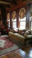 A living room with a couch, a chair, a table and a rug photo