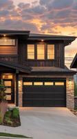 A modern home with a large garage door photo