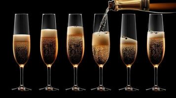 Champagne pouring into six glasses on a black background photo