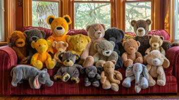 A large group of stuffed animals sitting on a couch photo