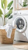 A washing machine with a basket of clothes in front of it photo