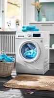 A washing machine with blue towels on the floor photo