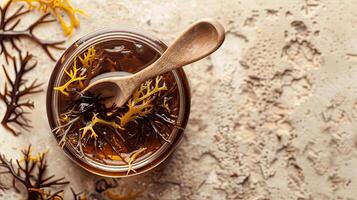 A bowl of seaweed with a spoon and a spoon photo
